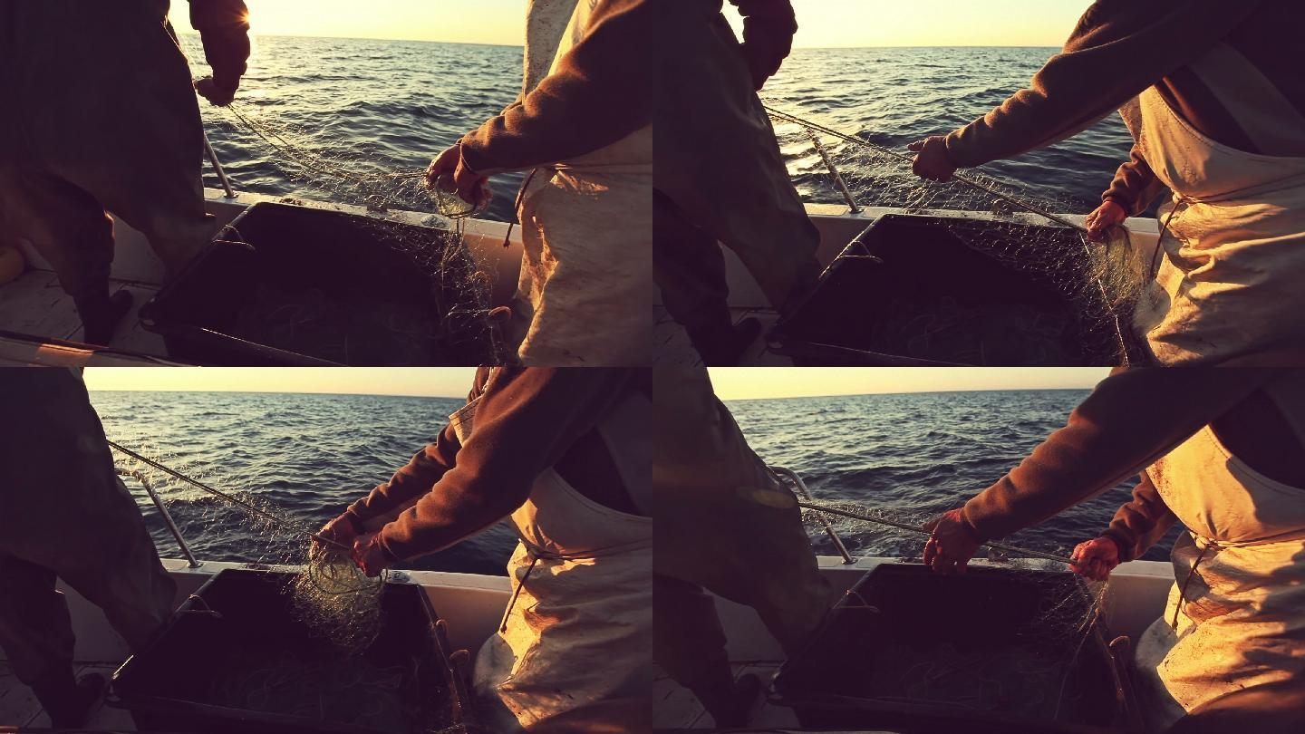 渔夫们收网捕鱼