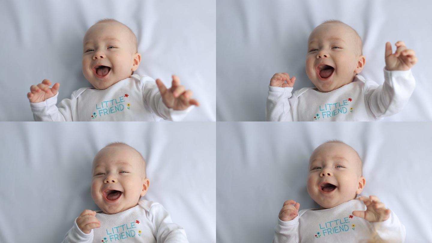 婴儿在床上大笑广告陪伴生活婴儿产品亲子互