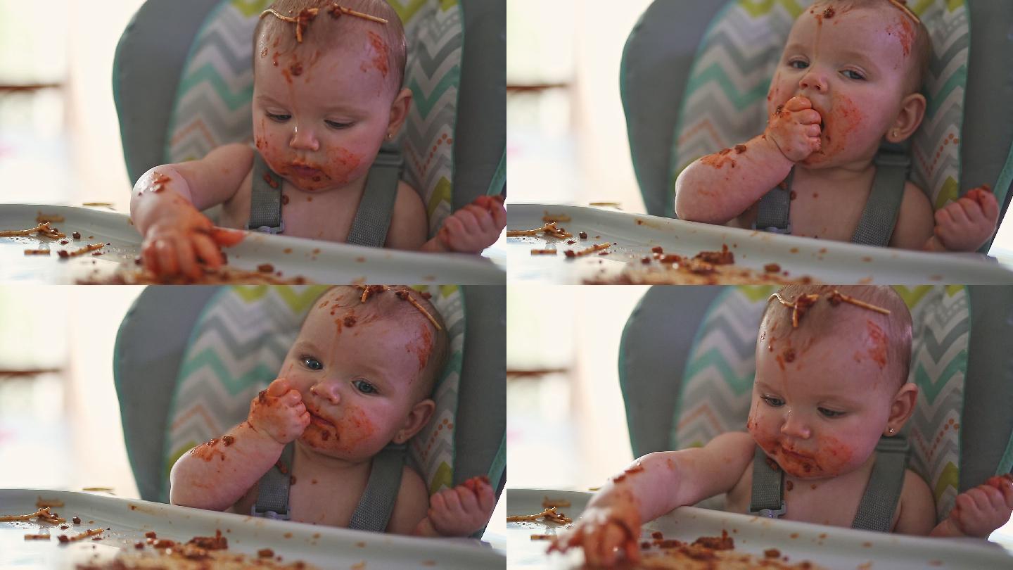小宝宝吃着晚餐婴儿-人的年龄人的手西红柿
