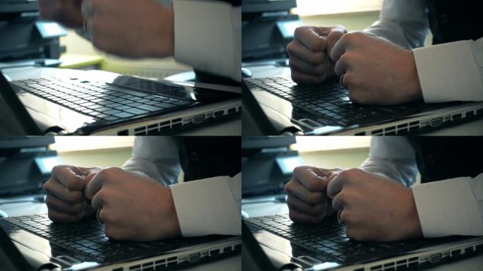 商人用拳头砸笔记本电脑