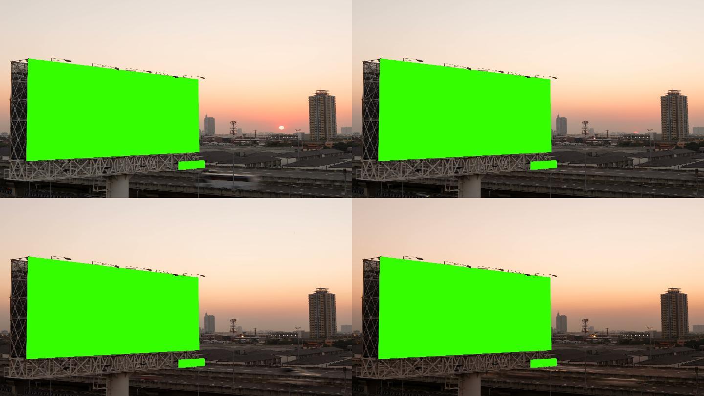 日落时高速公路上广告牌的绿色屏幕