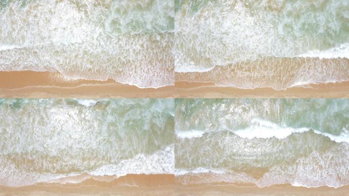 4K航拍鸟瞰海浪清晰见底的海滩素材