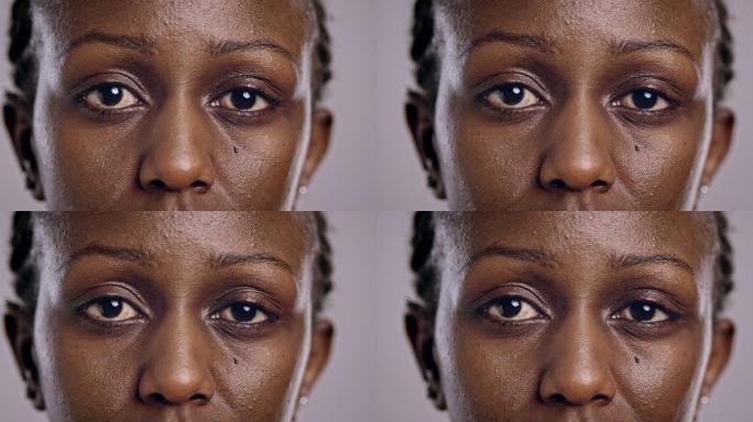 一位非洲裔美国妇女眨着眼睛