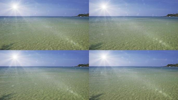 海上的太阳光芒照耀沿海地区海边海滩
