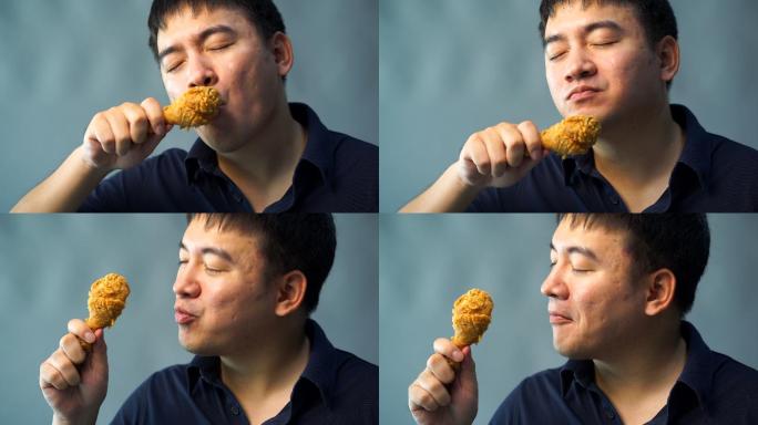 胖男人在吃炸鸡。