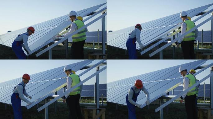 三名工人安装太阳能电池板