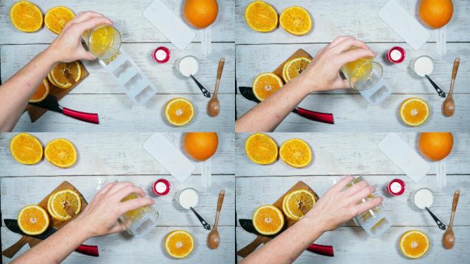 用橙汁、覆盆子果浆和酸奶制作自制冰棒