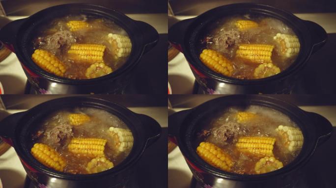 正在加热沸腾的玉米骨头汤