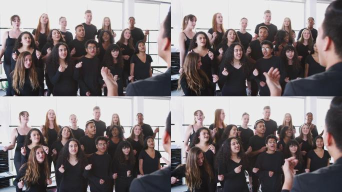 在表演艺术学校，男女学生与老师一起唱歌