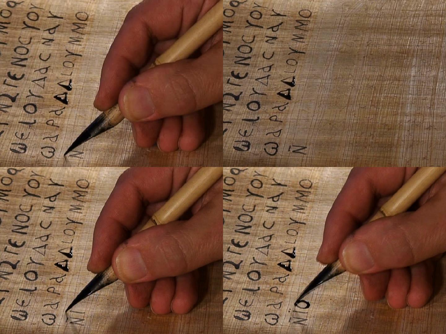用笔在纸莎草纸上书写古代文字