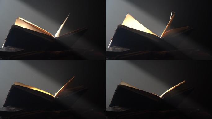 一束光束照亮了打开的书页