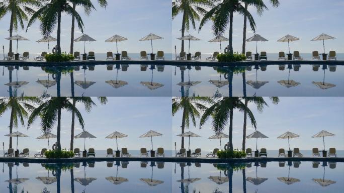 酒店和度假村内配有游泳池的漂亮雨伞和椅子