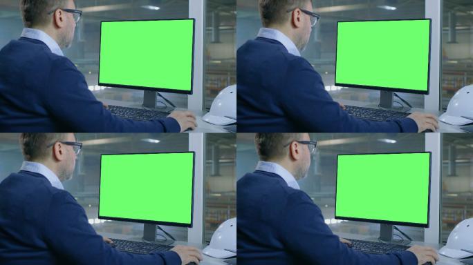 总工程师用计算机工作，电脑为绿屏