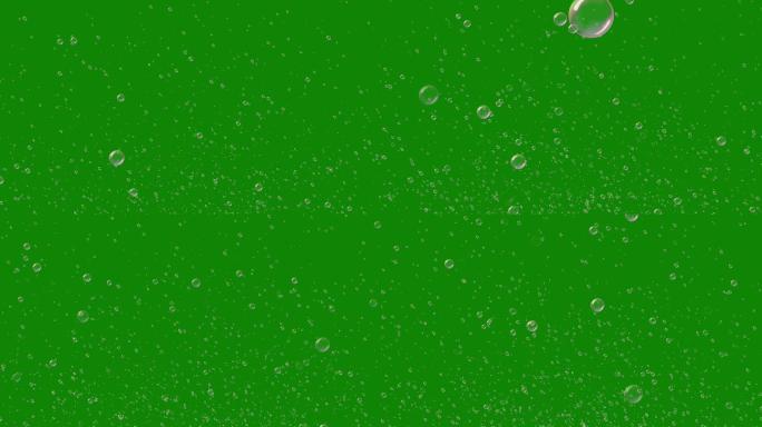 许多肥皂泡在绿屏上飞过，抠像