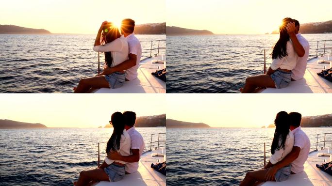 日落时游艇上的浪漫情侣
