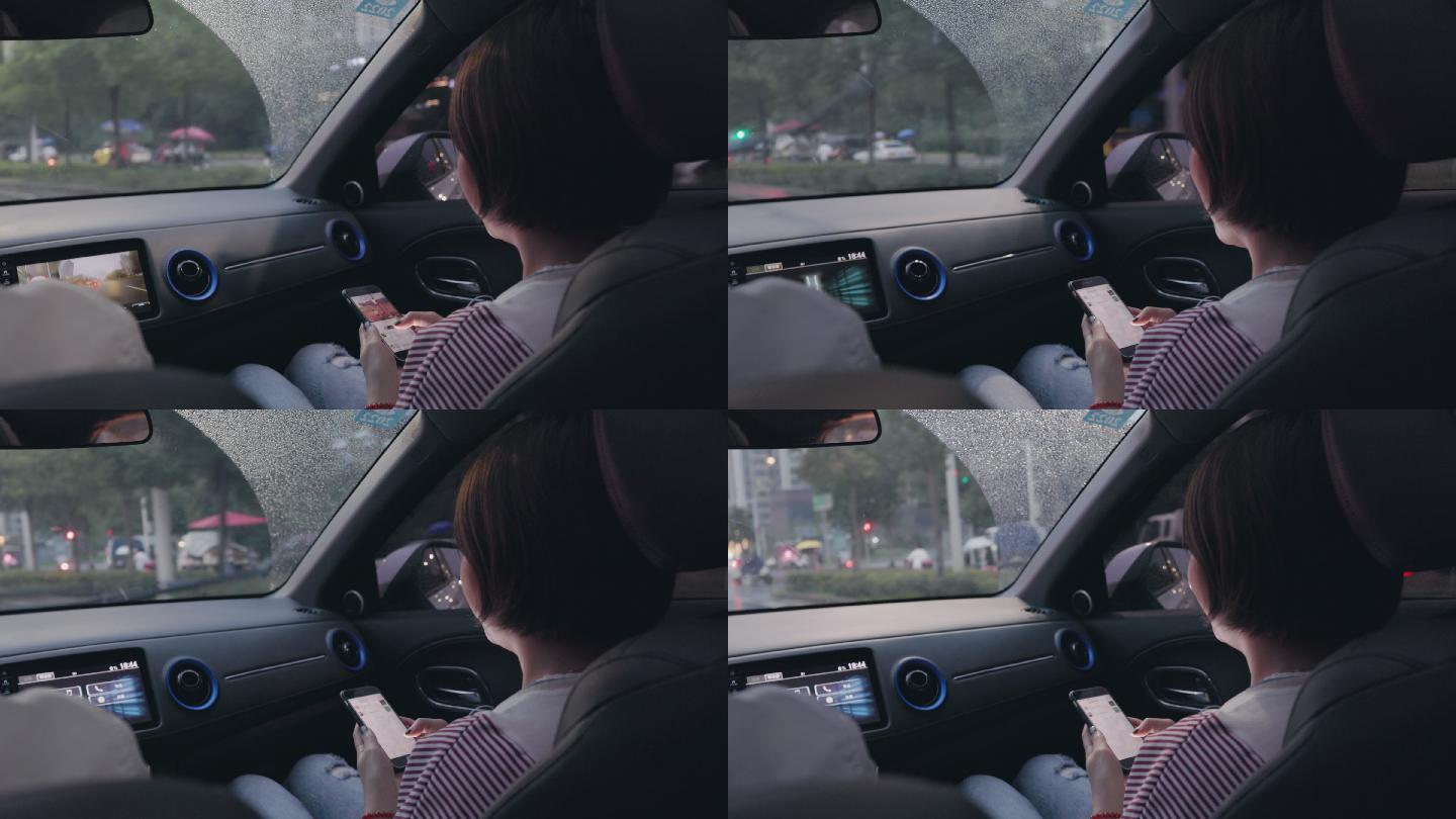 4K行驶中的汽车副驾上的年轻女性玩手机