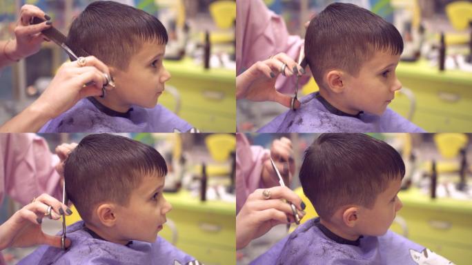 发型师为小男孩理发