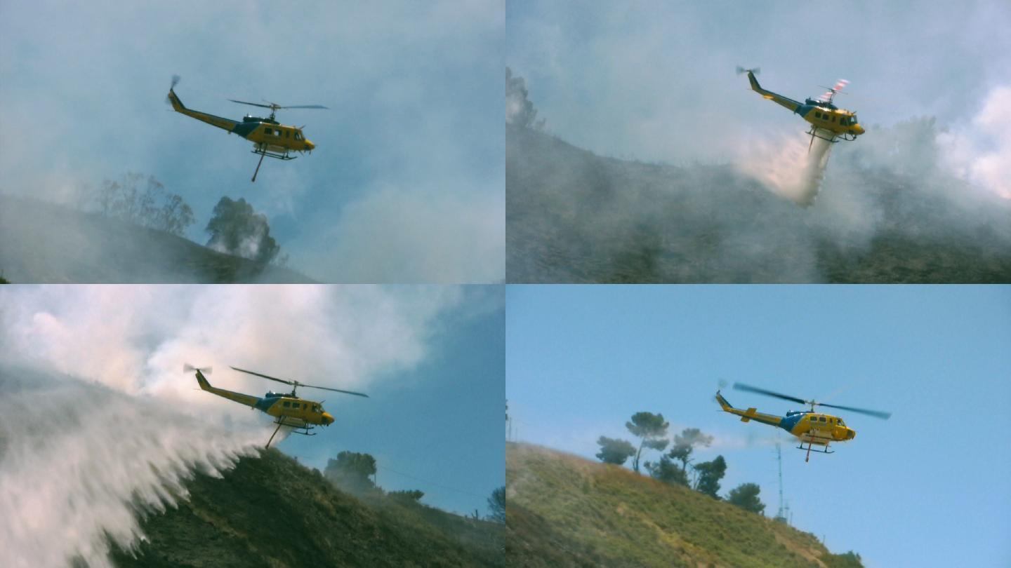 消防救援直升机在燃烧的山坡上投放阻燃剂