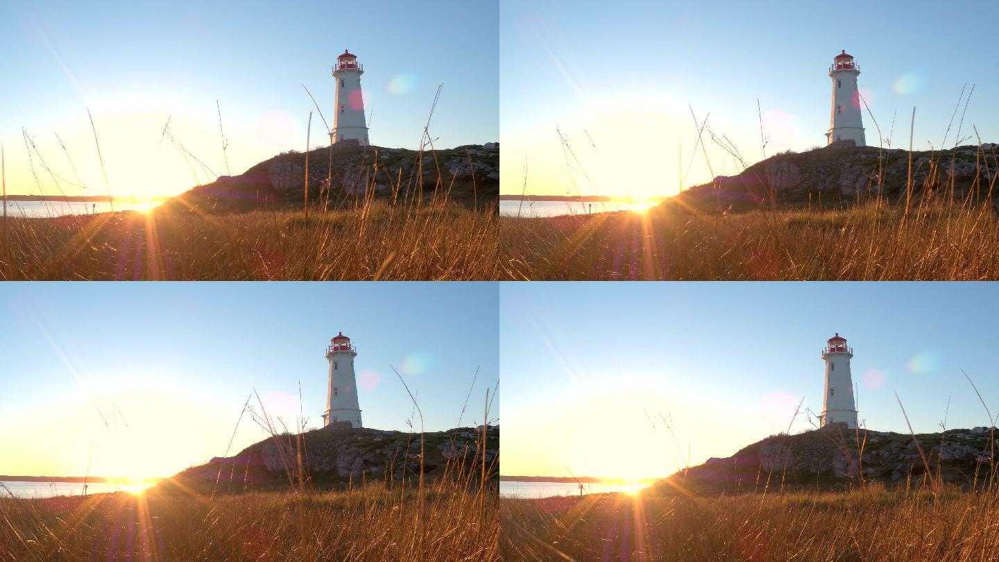 金光夕阳下，海岸上的混凝土灯塔