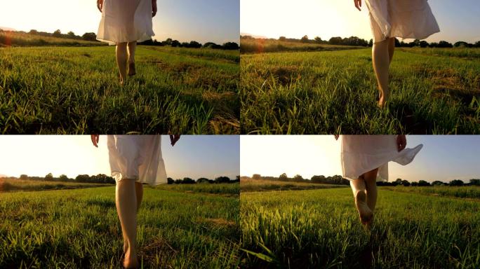 赤脚在草地上行走的一个年轻女子