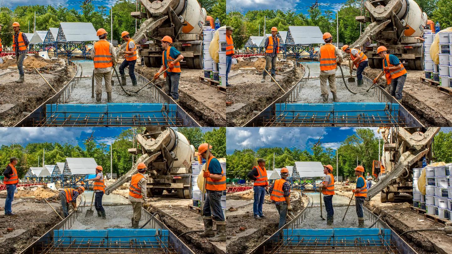 道路施工的混凝土工程，有许多工人和搅拌机