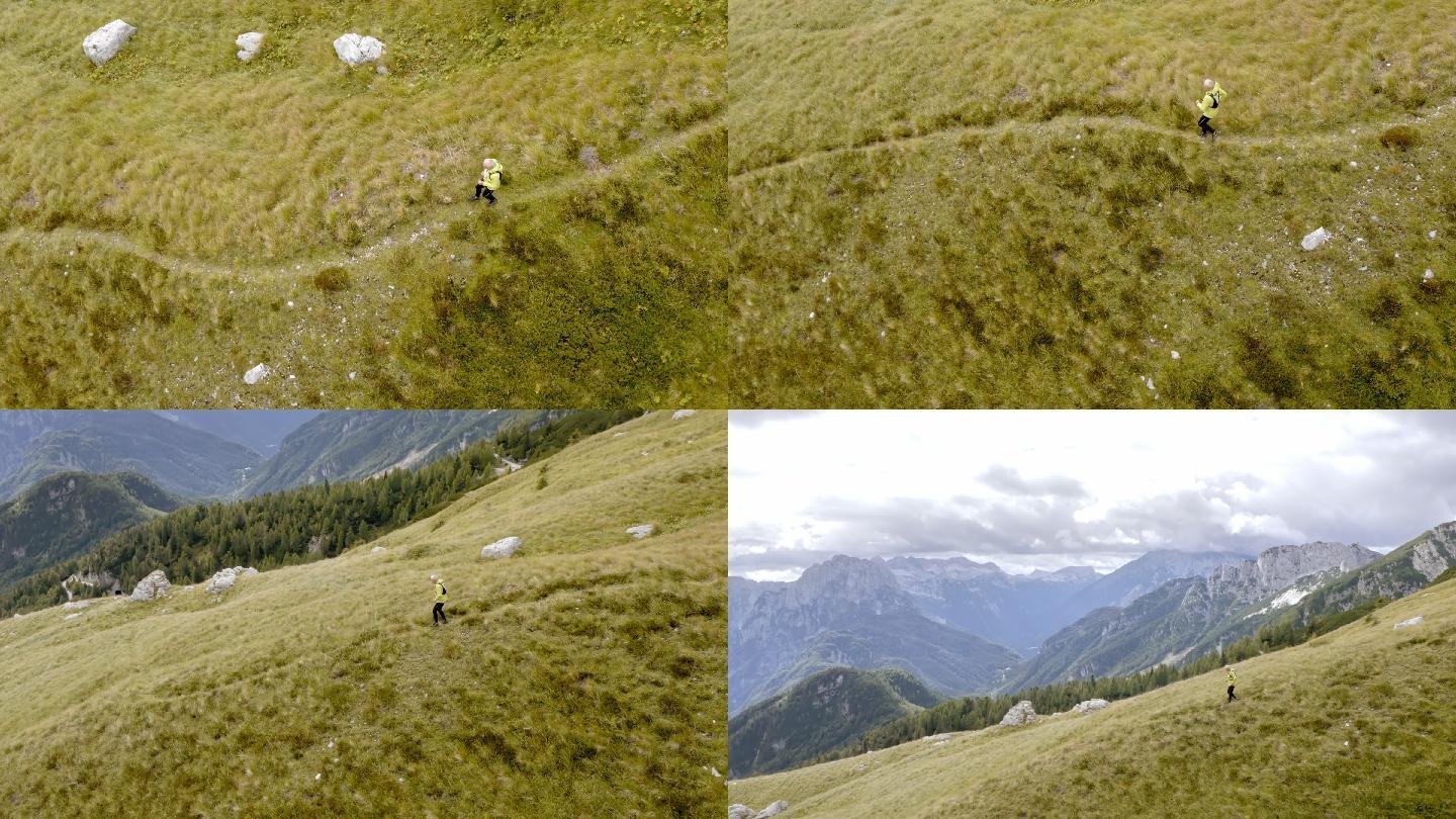 一名跑步运动员在山上的草地上奔跑