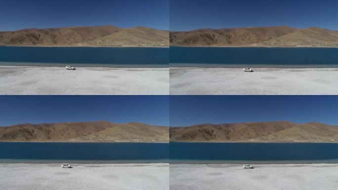 西藏羊湖边越野车