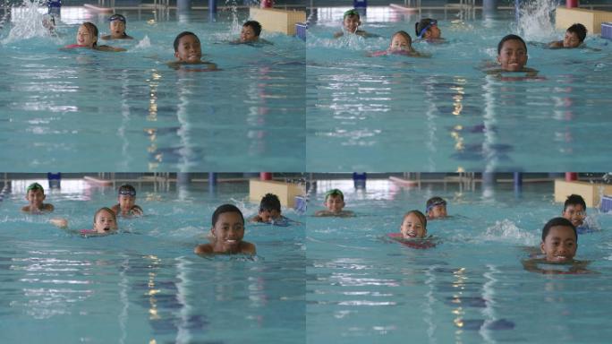 孩子们在健身中心的游泳池里游泳