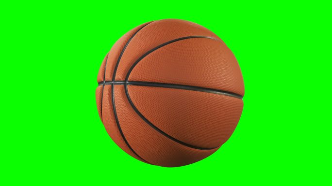 篮球在绿色屏幕上以慢动作旋转