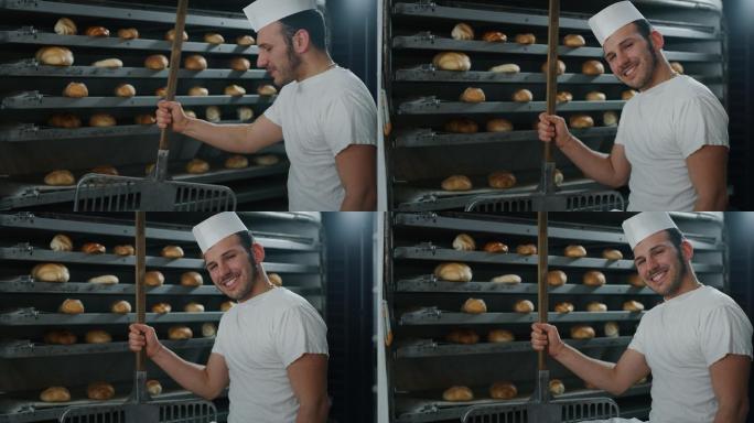 面包师从烤箱里拿出热面包的慢镜头特写。