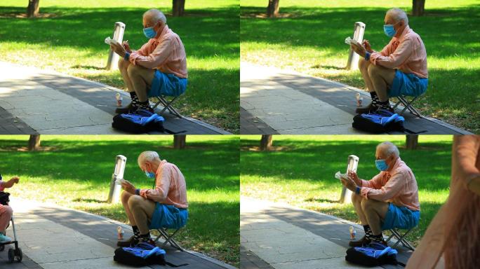 公园里一名外国老人在画画