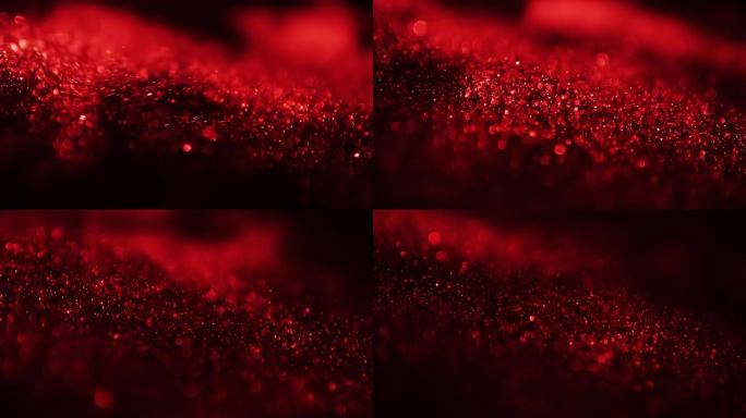 红色粒子颗粒光斑流动抽象背景