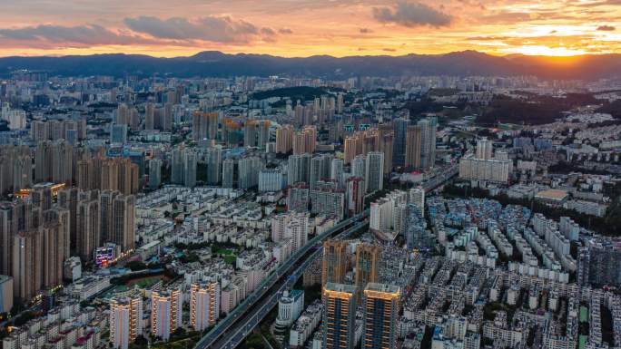 昆明北市区夕阳航拍大范围延时4K