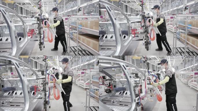 中国工厂内汽车装配生产线工人在工作