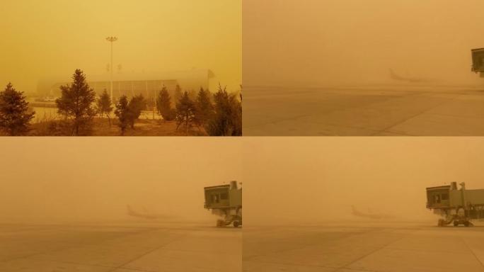 沙尘天气中的甘肃省机场大楼和飞机