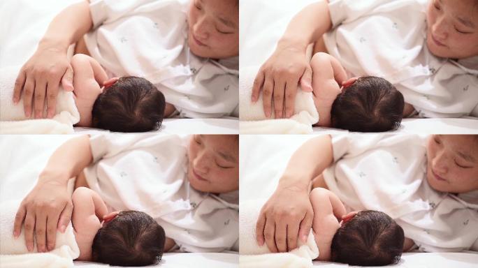 亚洲女性侧躺哺乳婴儿