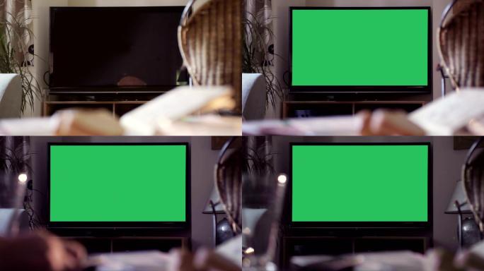 用遥控器打开带有绿色屏幕的电视机