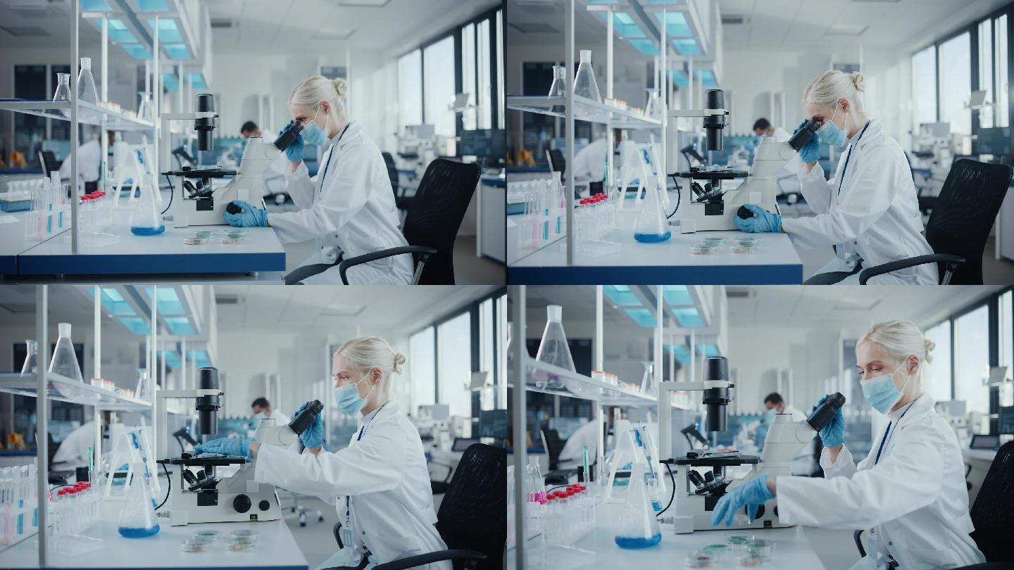 女性科学家戴口罩在实验室工作
