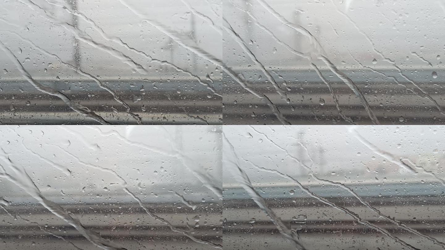高铁窗外雨滴划过氛围阴天下雨