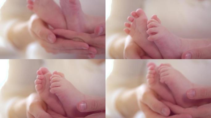 婴儿的脚在妈妈的手里.