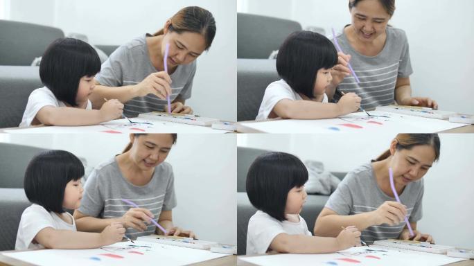 快乐的亚洲母女一起画画