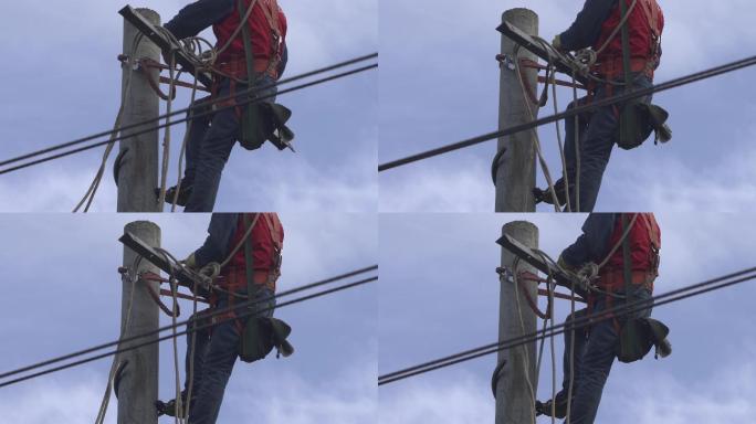 电力抢修人员爬上电线杆顶工作06