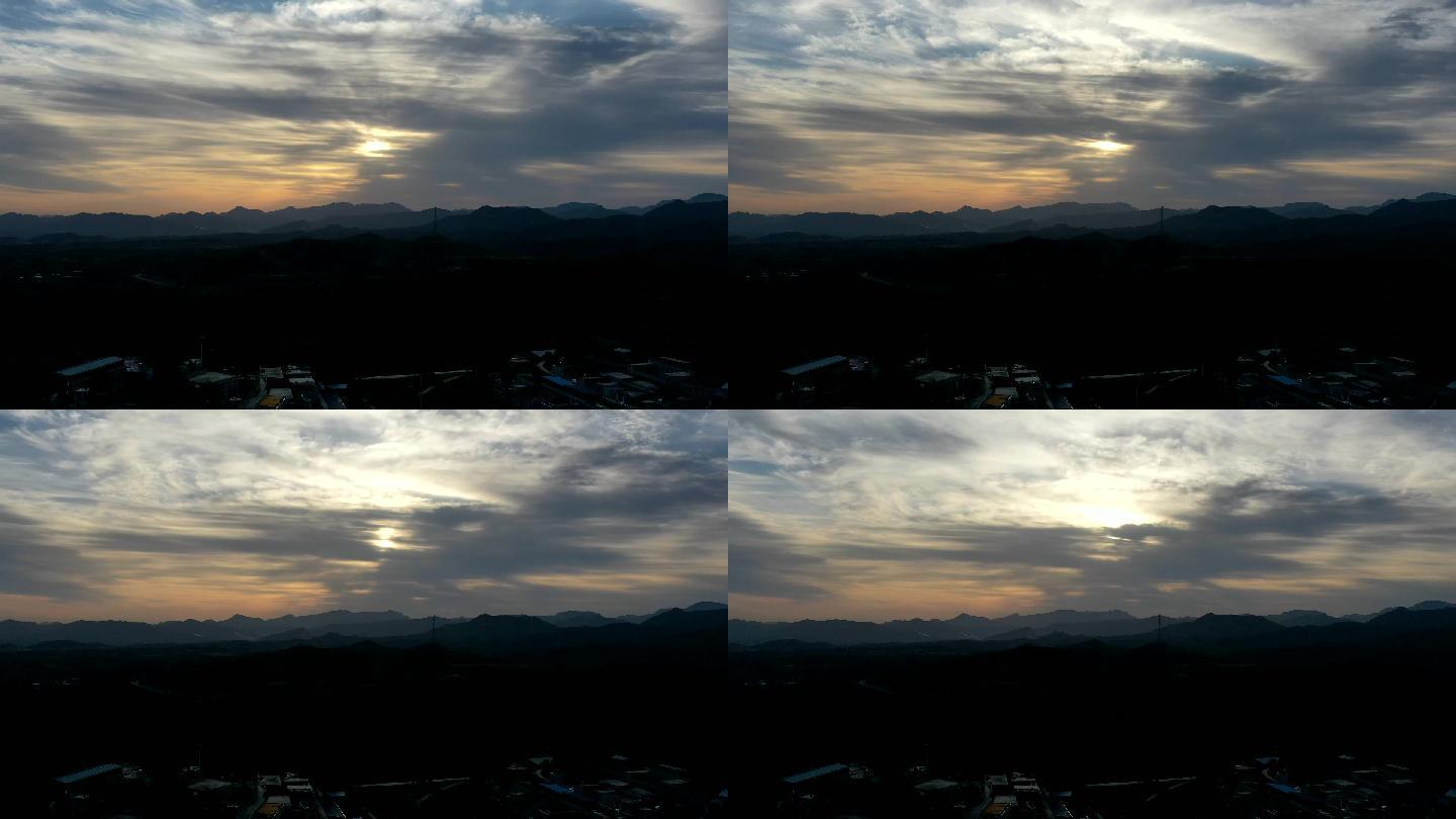 山地山区太阳光束穿过云层云彩延时日出