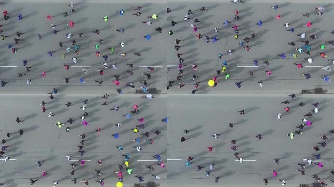 沥青路面上马拉松运动员自上而下的空中拍摄