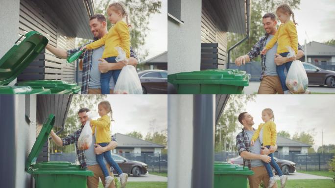 父亲抱着女孩，准备把垃圾扔进垃圾桶