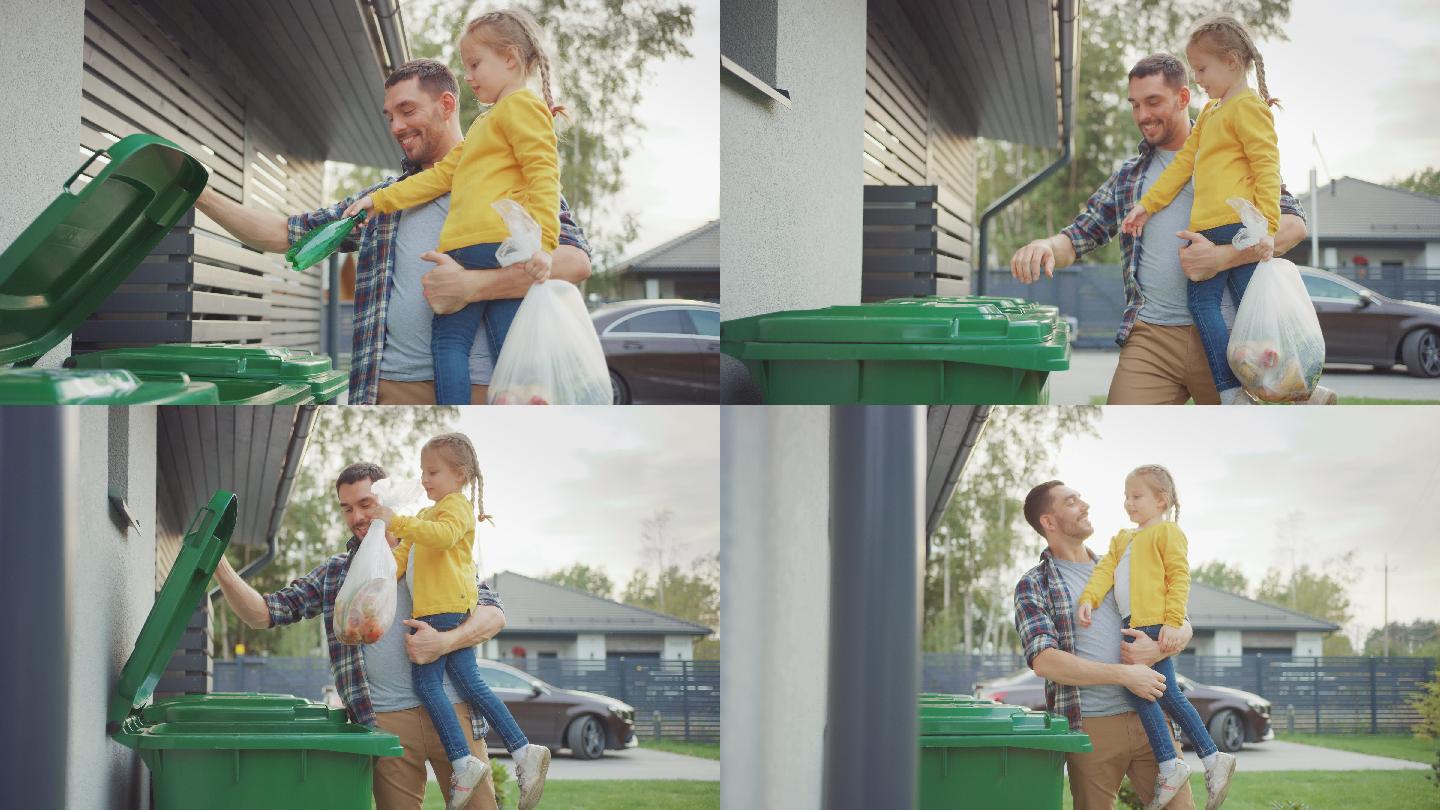父亲抱着女孩，准备把垃圾扔进垃圾桶