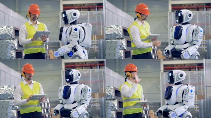 工厂员工正在用手势与机器人交流