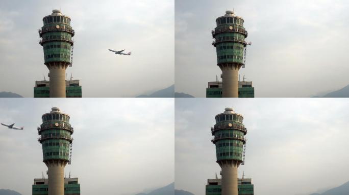 飞机飞过空中交通管制塔