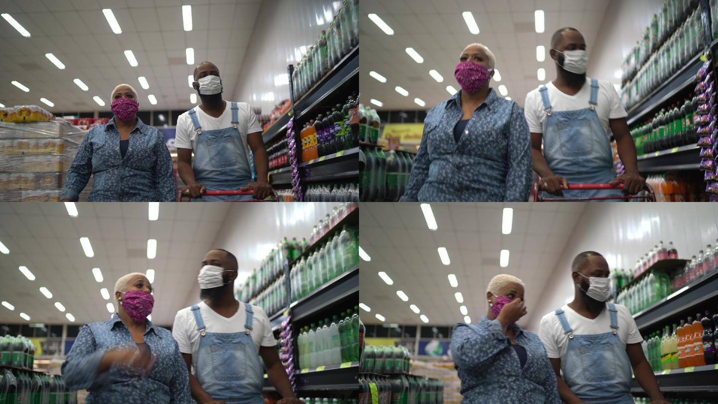 戴着口罩的夫妇在超市购物