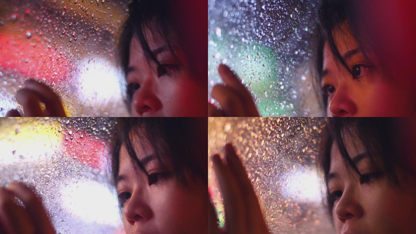 雨夜伤感女孩靠在车窗看窗外眼睛特写